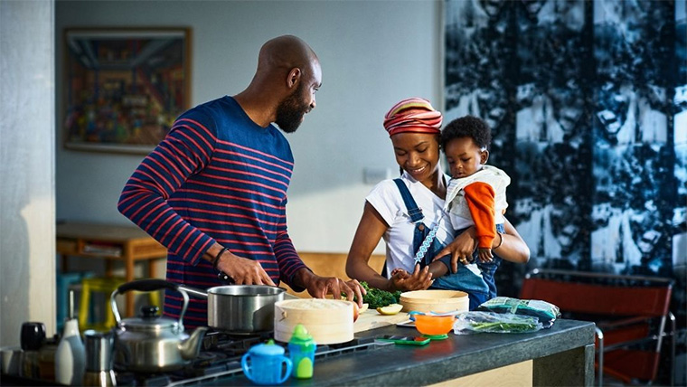 Family of three cooking in the kitchen