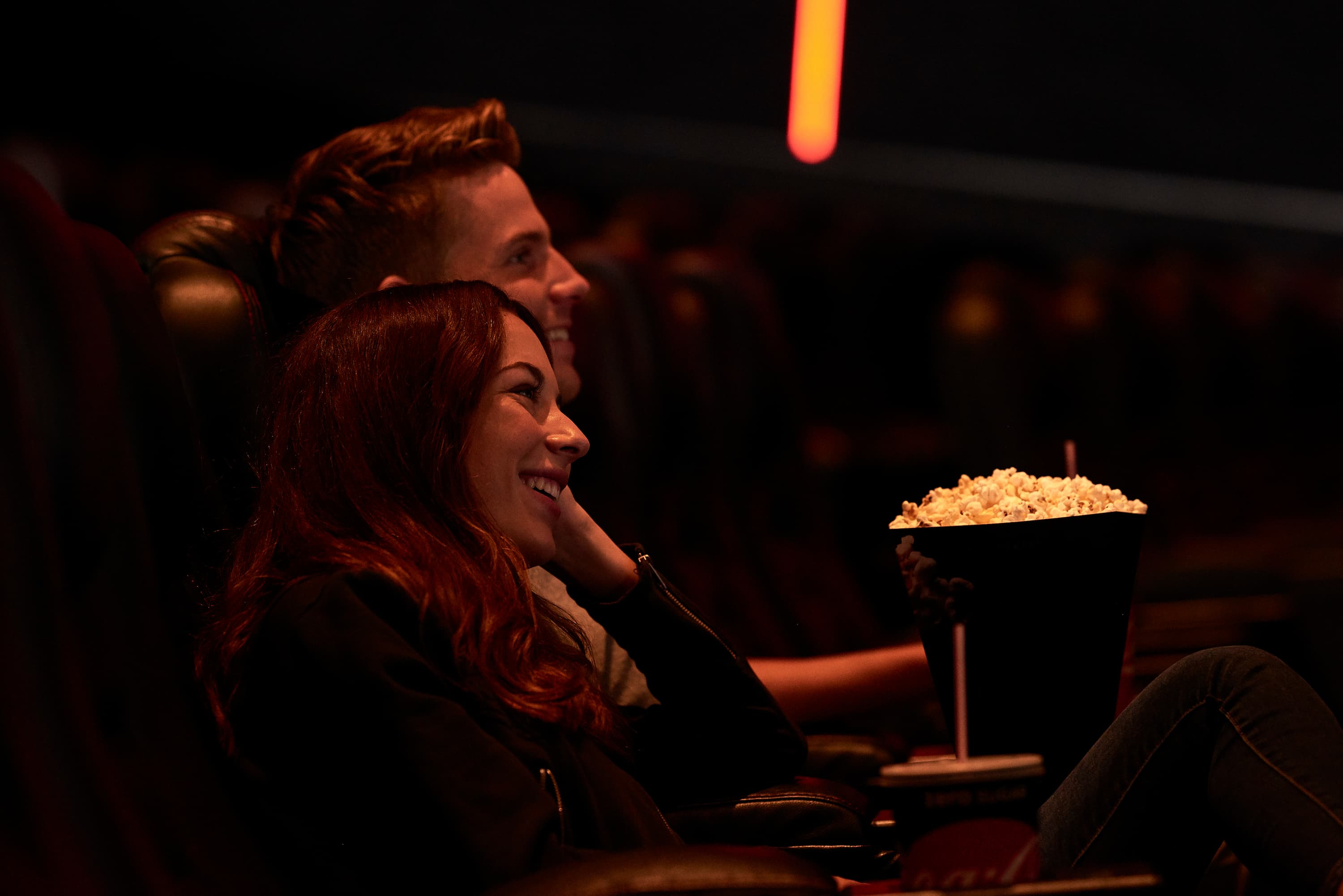 couple at the cinema with popcorn