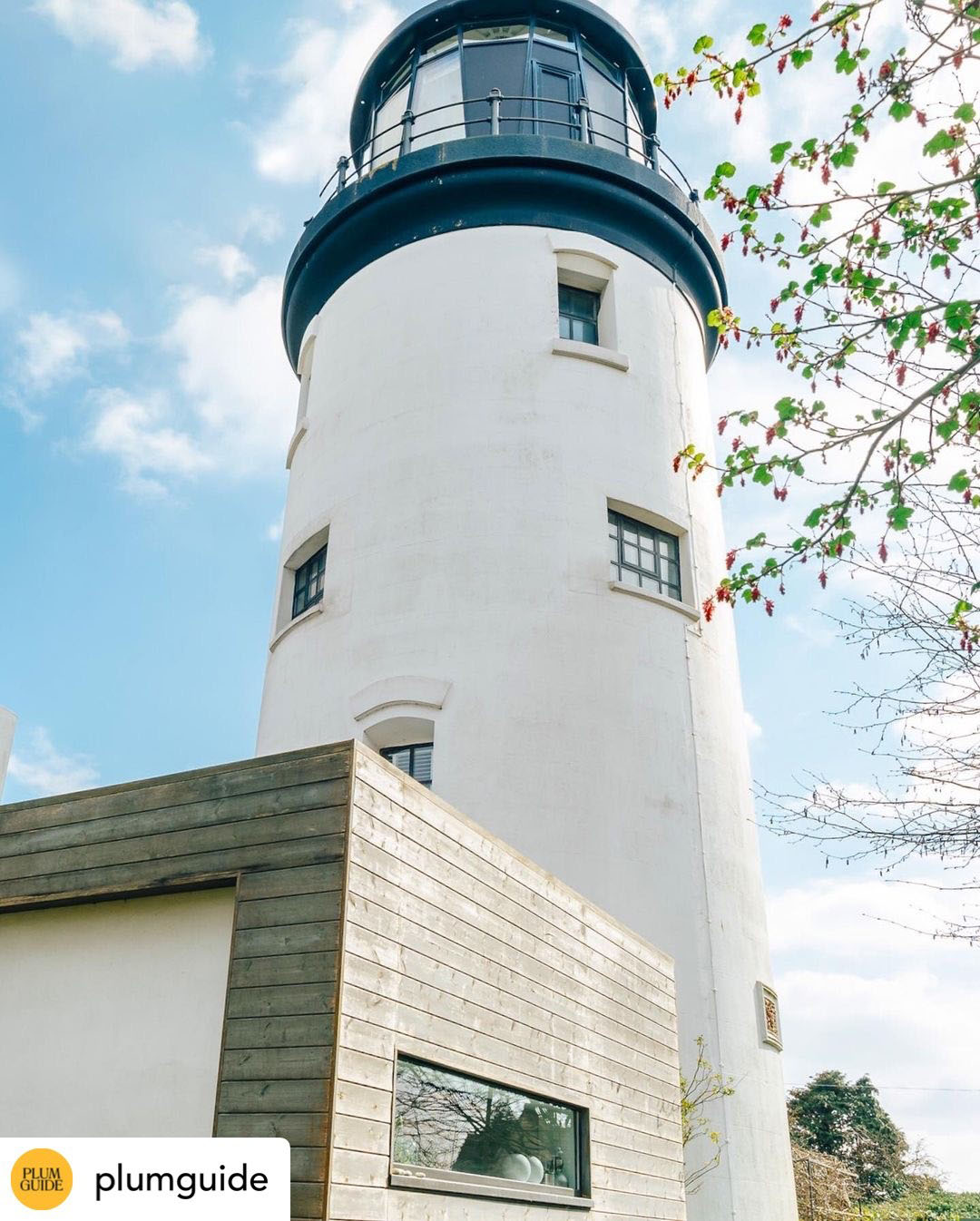 A white lighthouse. Credit: Plum Guide.