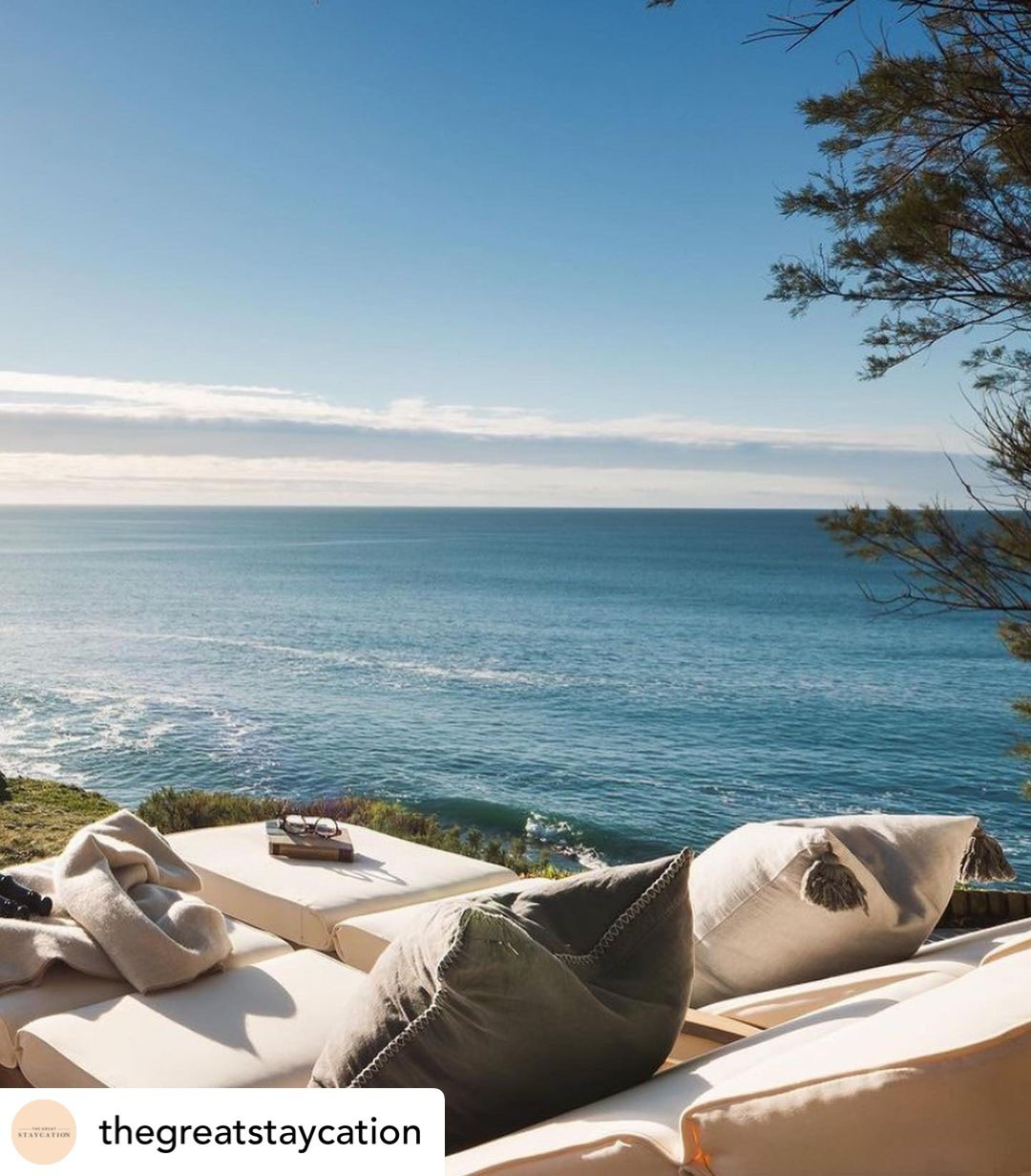 Two outdoor day beds with an sunny ocean view. Credit: The Great Staycation.