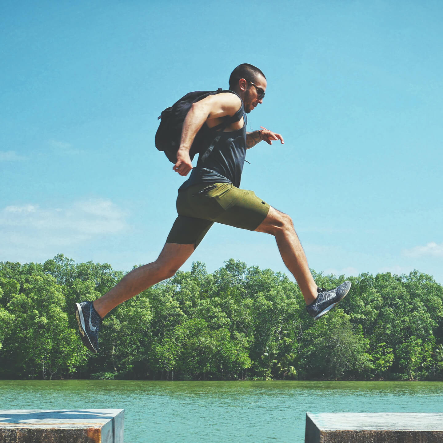 Man leaping from one platform to another